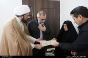 دیدار استاندار مرکزی با مادر شهید "حسن عاشری" در شهر میلاجرد